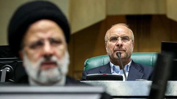 Iran’s parliament speaker Mohammad-Bagher Ghalibaf (right) and President Ebrahim Raisi