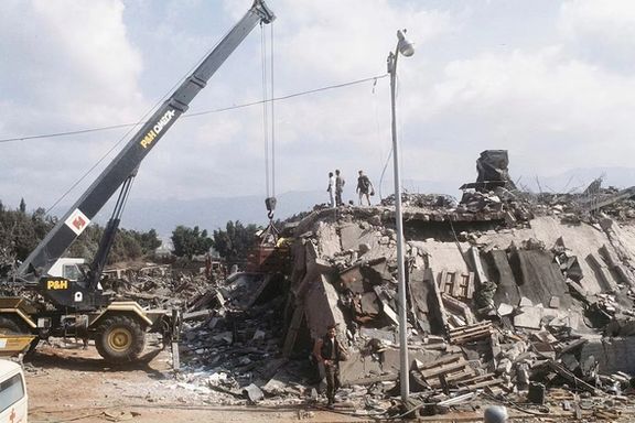 A crane is brought in after the explosion of the Marine Corps building in Beirut, Lebanon October 23, 1983.