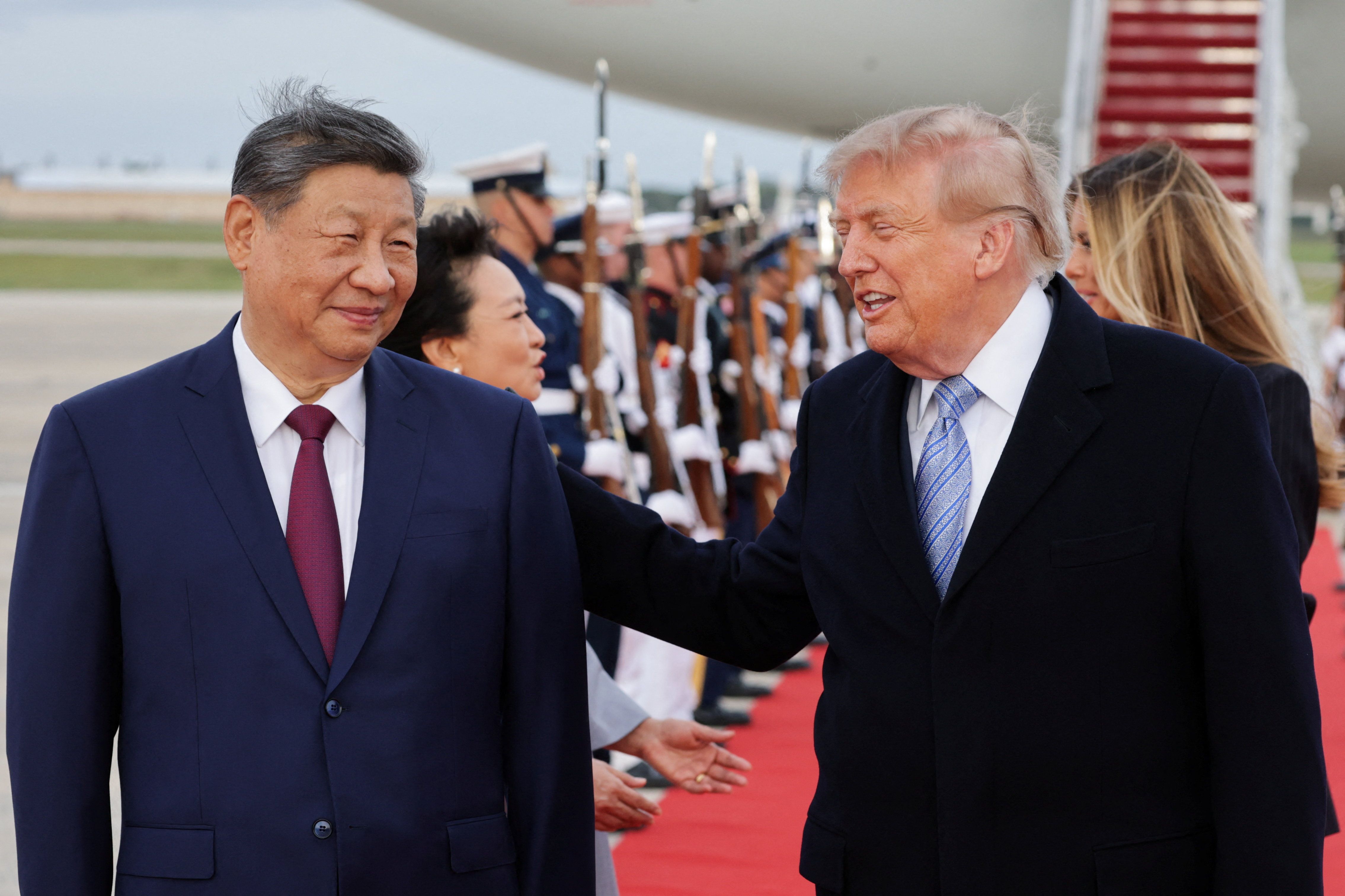 US President Donald Trump and Chinese President Xi Jinping react as Xi arrives ahead of a state visit at Joint Base Andrews, Maryland, US, September 23, 2026.  