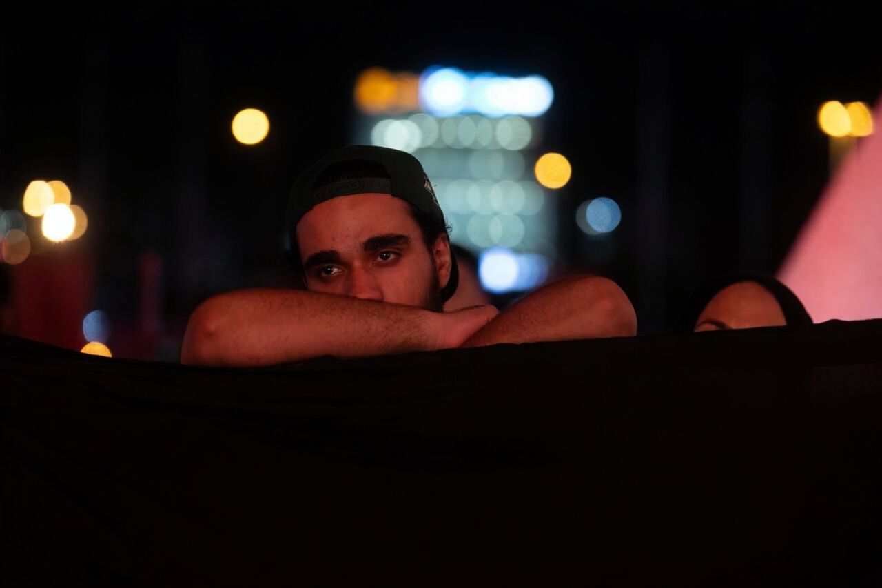 A man attending a religious ceremony marking the death of the third Shiite Imam, July 2025