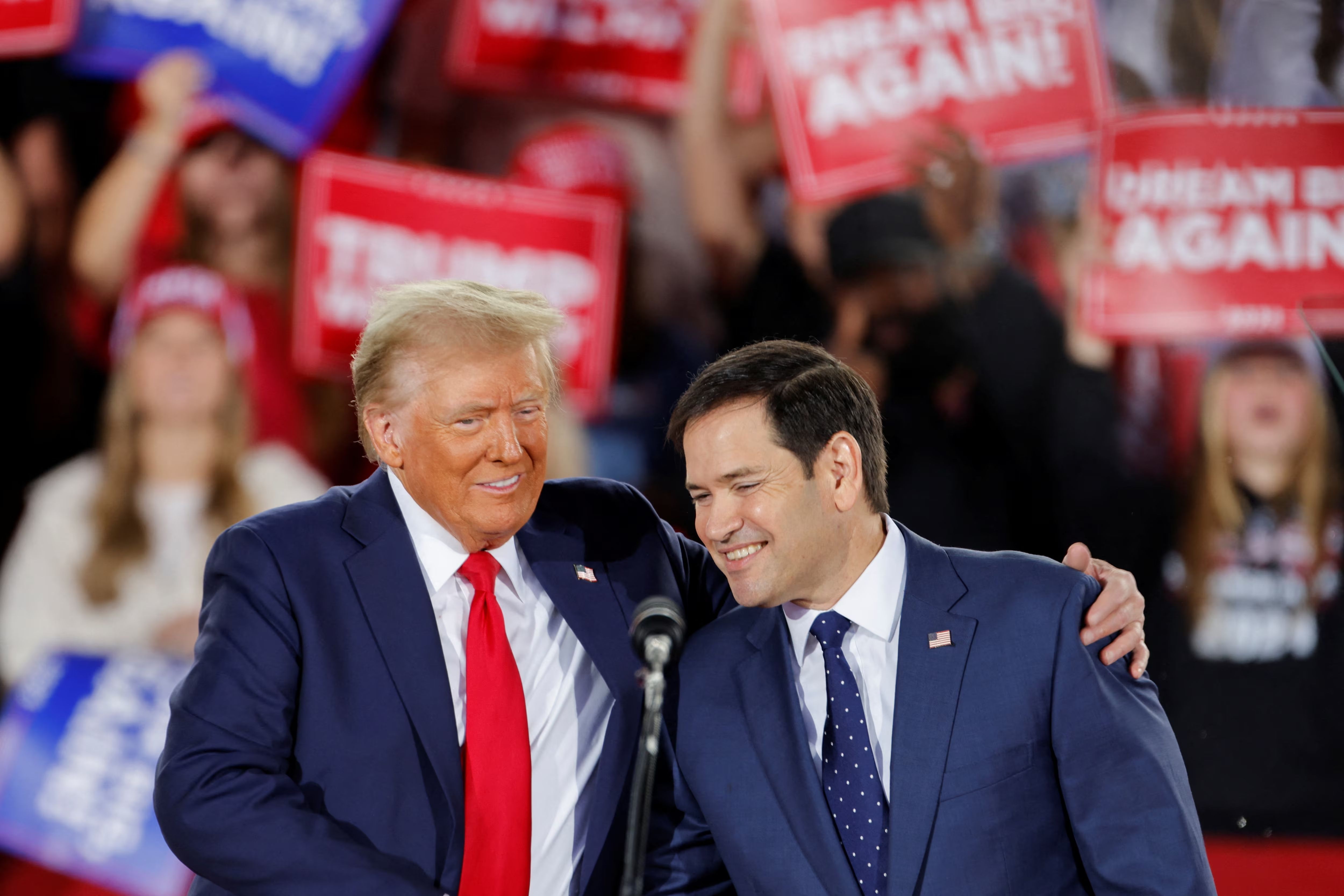 Donald Trump and Senator Marco Rubio (R-FL) react during a campaign event at Dorton Arena, in Raleigh, North Carolina, November 4, 2024. 