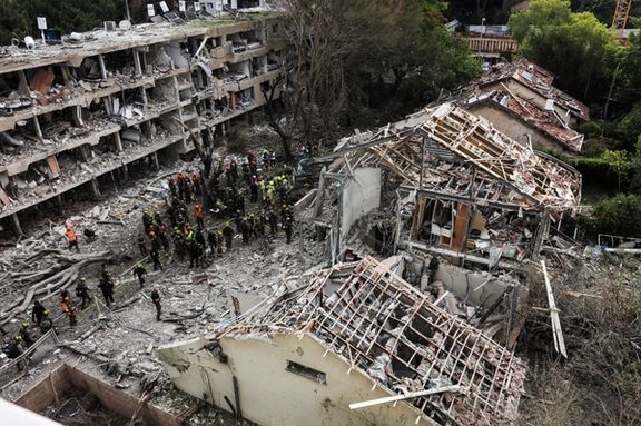 Rescuers and security personnel work at the impacted site after a missile attack from Iran, amid the Iran-Israel conflict in Tel Aviv, Israel June 22, 2025.