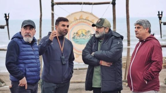 Siamak Ansari (left) and Mehran Ghafourian (2nd left) behind the scenes of the show (undated)