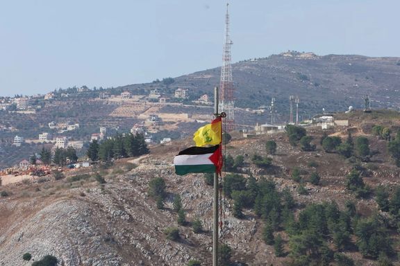 Palestinian and Hezbollah flags flutter in Khiam, near the border with Israel, in southern Lebanon October 9, 2023.
