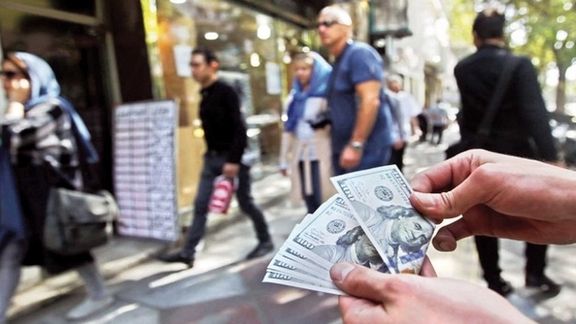 A man dealing dollar in a street in Iran