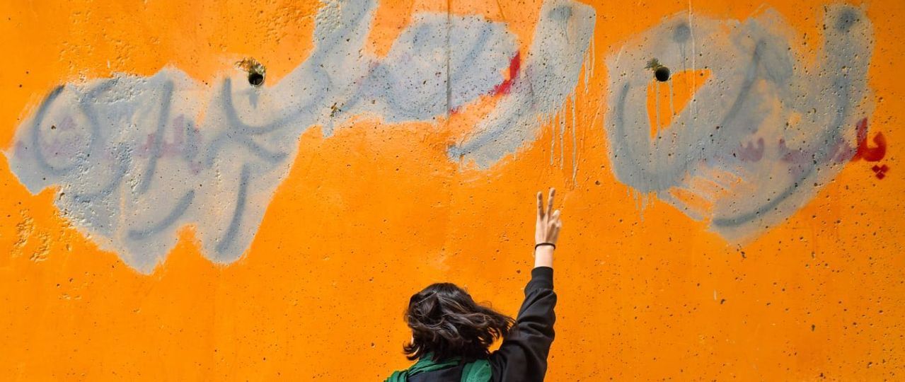 Walls Falling Under Weight Of Anti-Regime Graffiti In Iran