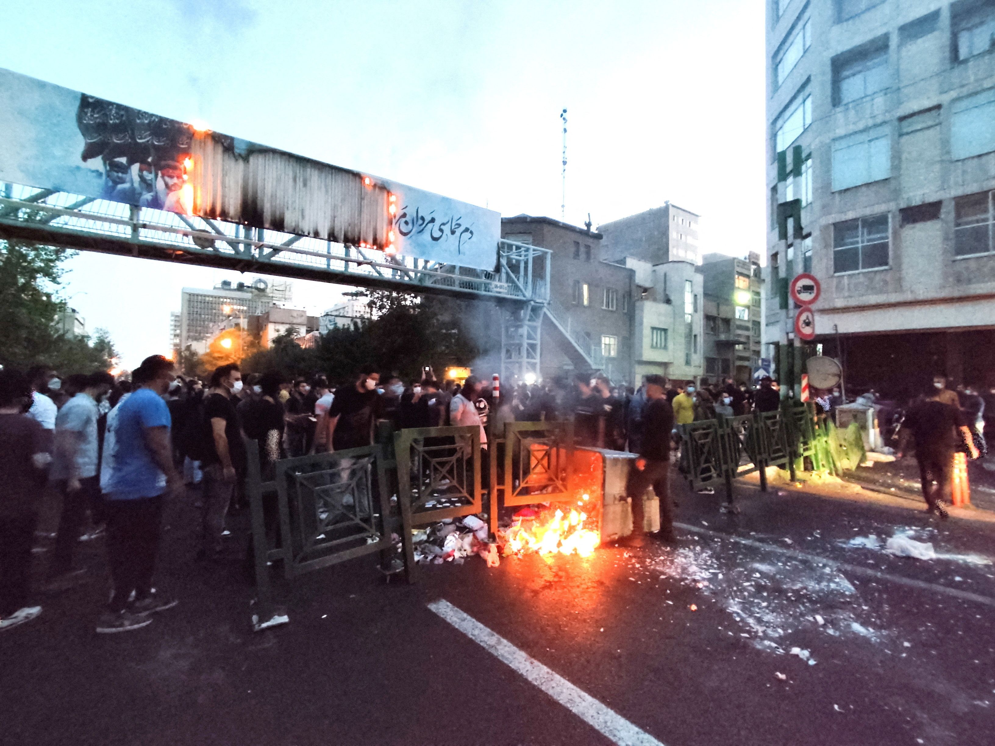 People light a fire during a protest in Tehran, Iran September 21, 2022. 