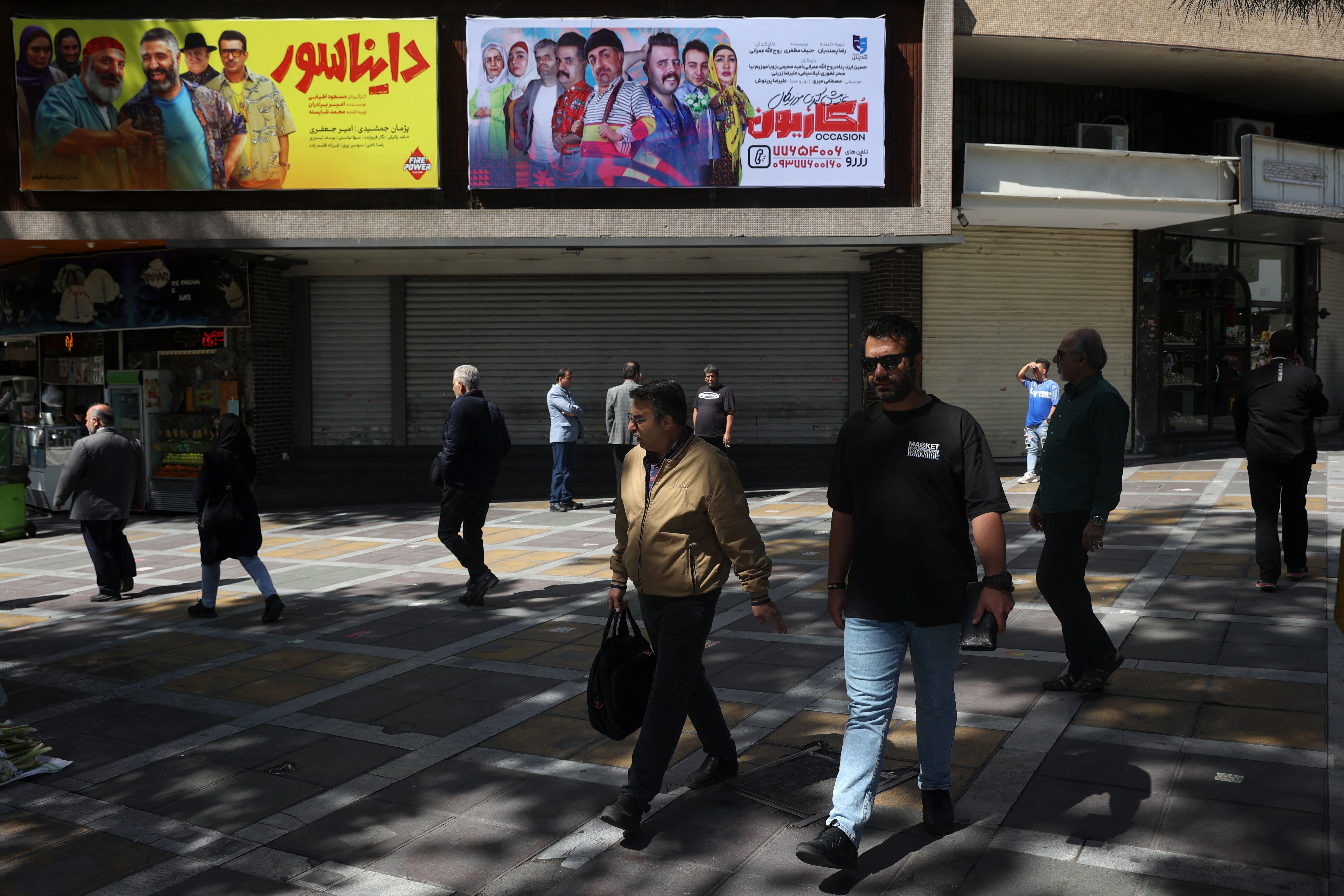 People walk on a street in Tehran, Iran, April 19, 2025.