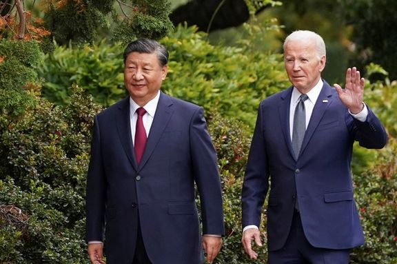 US President Joe Biden waves as he walks with Chinese President Xi Jinping on the sidelines of the Asia-Pacific Economic Cooperation (APEC) summit, in Woodside, California, November 15, 2023.