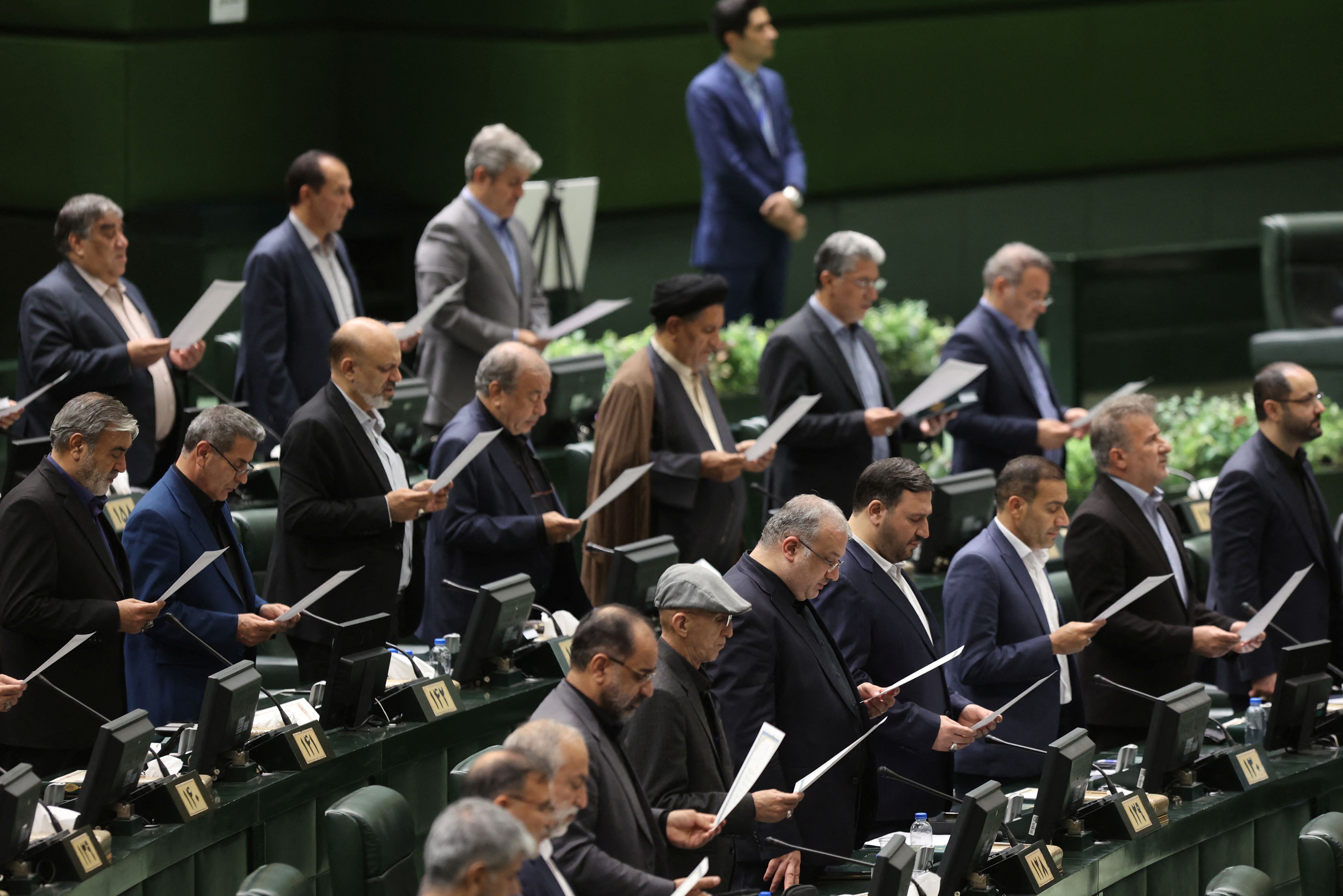 Members of Parliament swear oath during the opening ceremony of Iran's 12th parliament in Tehran, Iran, May 27, 2024.