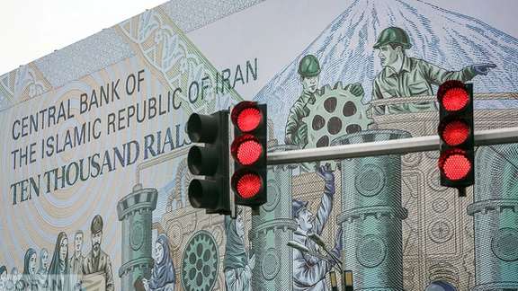 File photo of a mural at Tehran’s Enqelab square showing the Iranian 10,000-rial banknote worth less than two cents now
