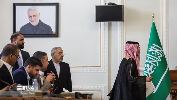 Saudi Arabia's Foreign Minister Prince Faisal bin Farhan Al Saud walking out of a conference room in protest to a picture of IRGC general Qassem Soleimani, Iran’s architect of proxy wars in the Middle East, Tehran, June 17, 2023