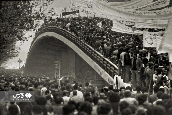 Iranians march on a street in Tehran in February 1979