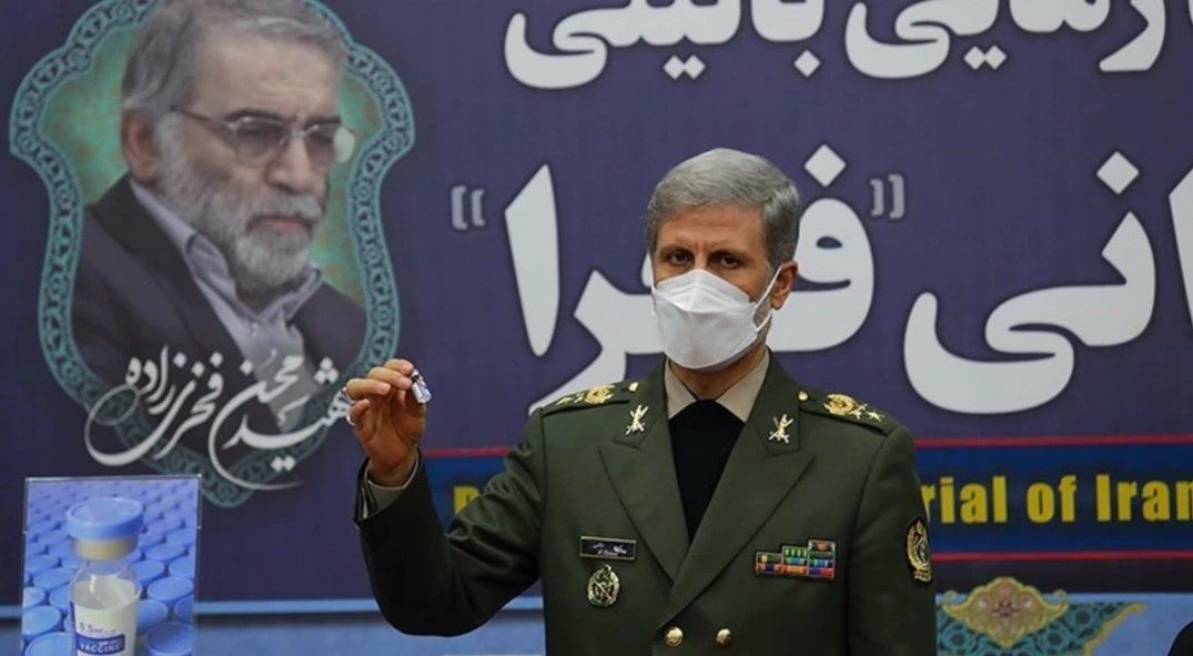 An Iranian military commander showing a sample of a homegrown Covid vaccine in 2021