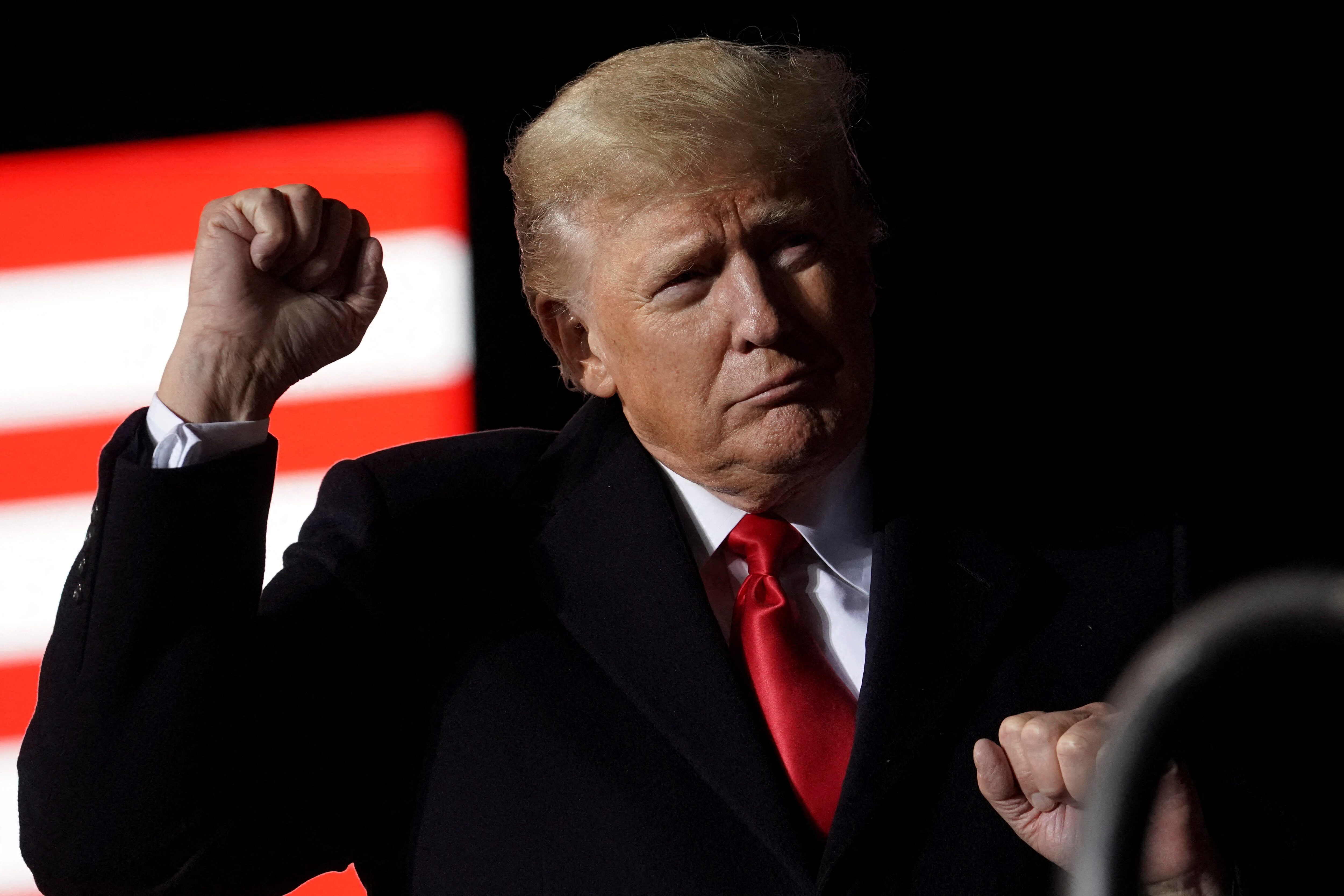 Donald Trump gestures as he speaks during a rally, in Conroe, Texas, US, January 29, 2022.