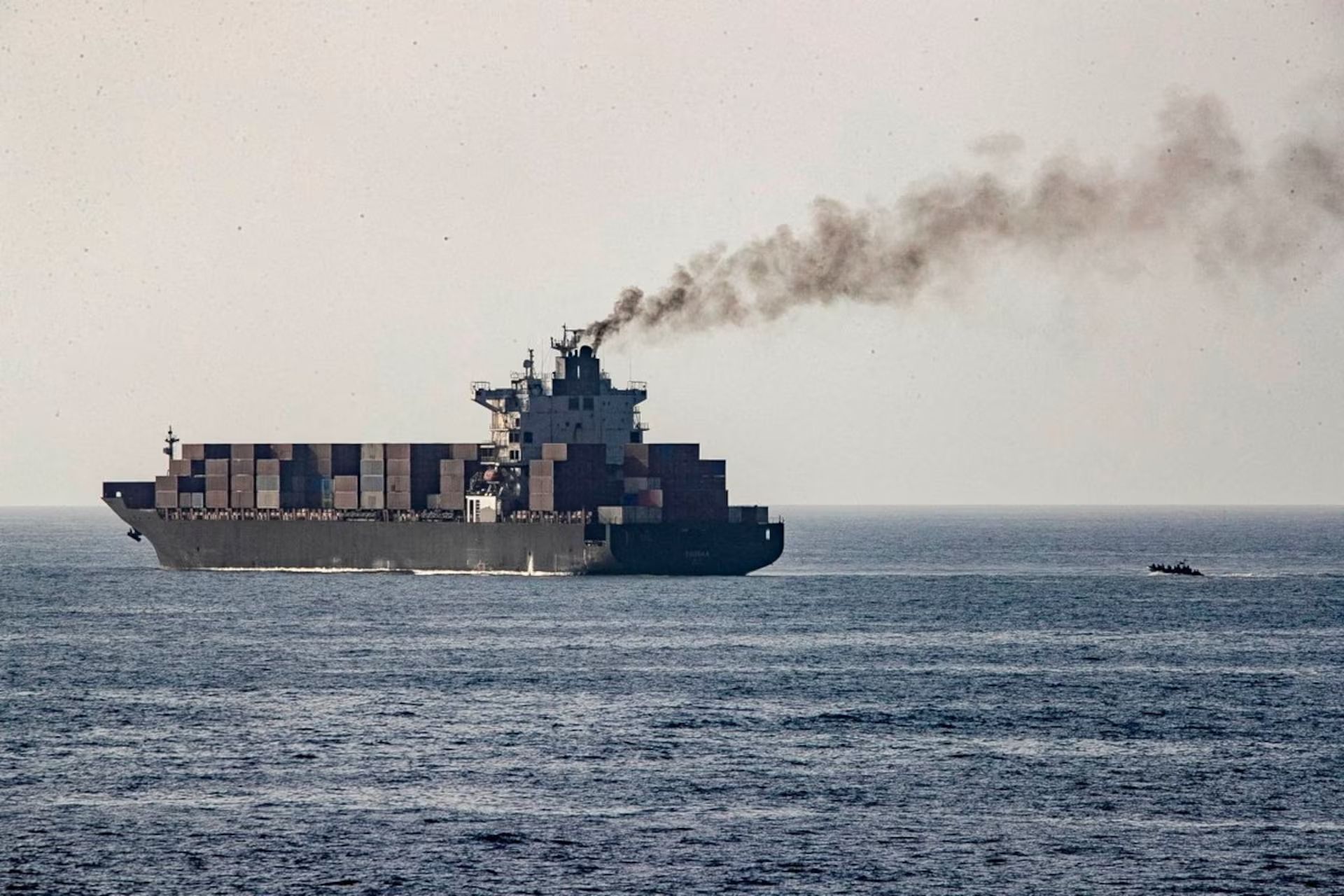 US forces patrol near the Iranian-flagged cargo ship M/V Touska after it was boarded and seized by US forces at a location given as the Arabian Sea.  