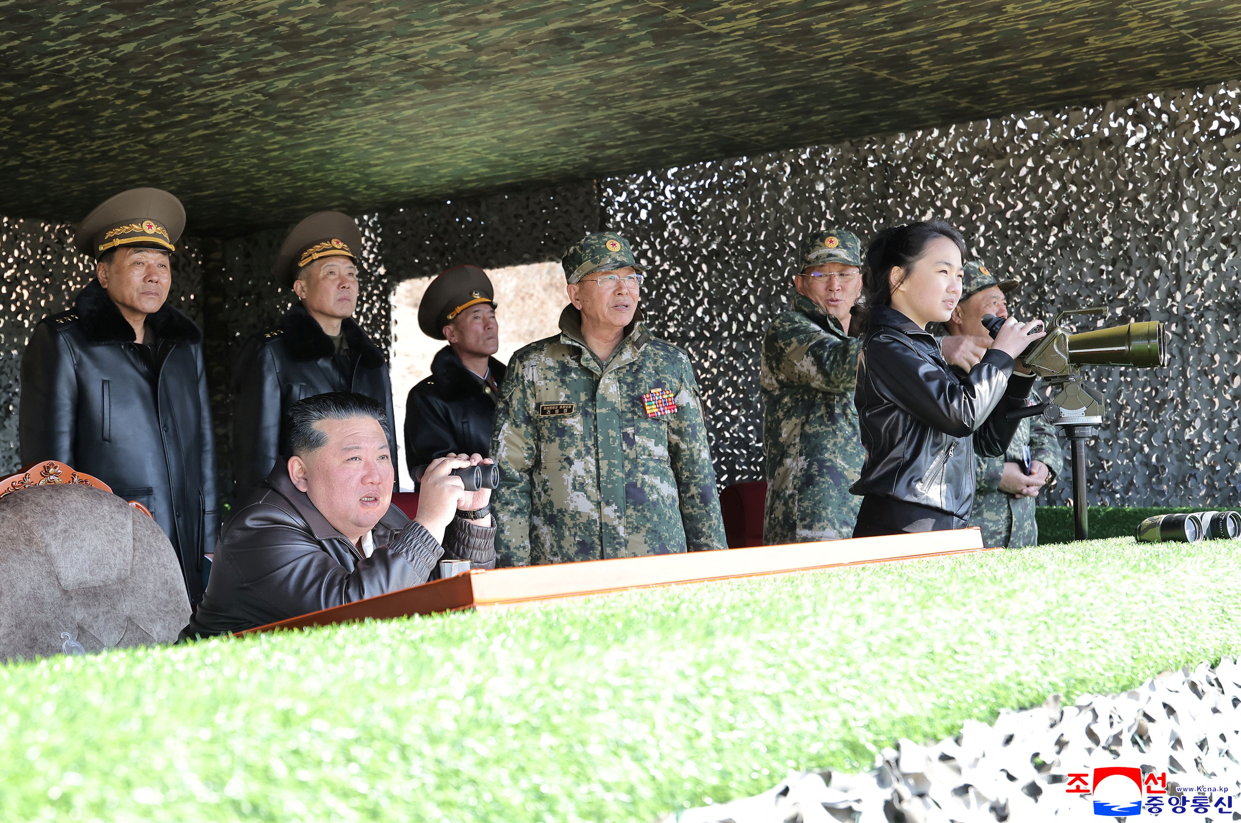 North Korean leader Kim Jong Un, accompanied by his daughter Kim Ju Ae, supervises what North Korean state news agency KCNA reports is an offensive tactical drill involving a new type of tank, at a training base in Pyongyang, North Korea, March 19, 2026,