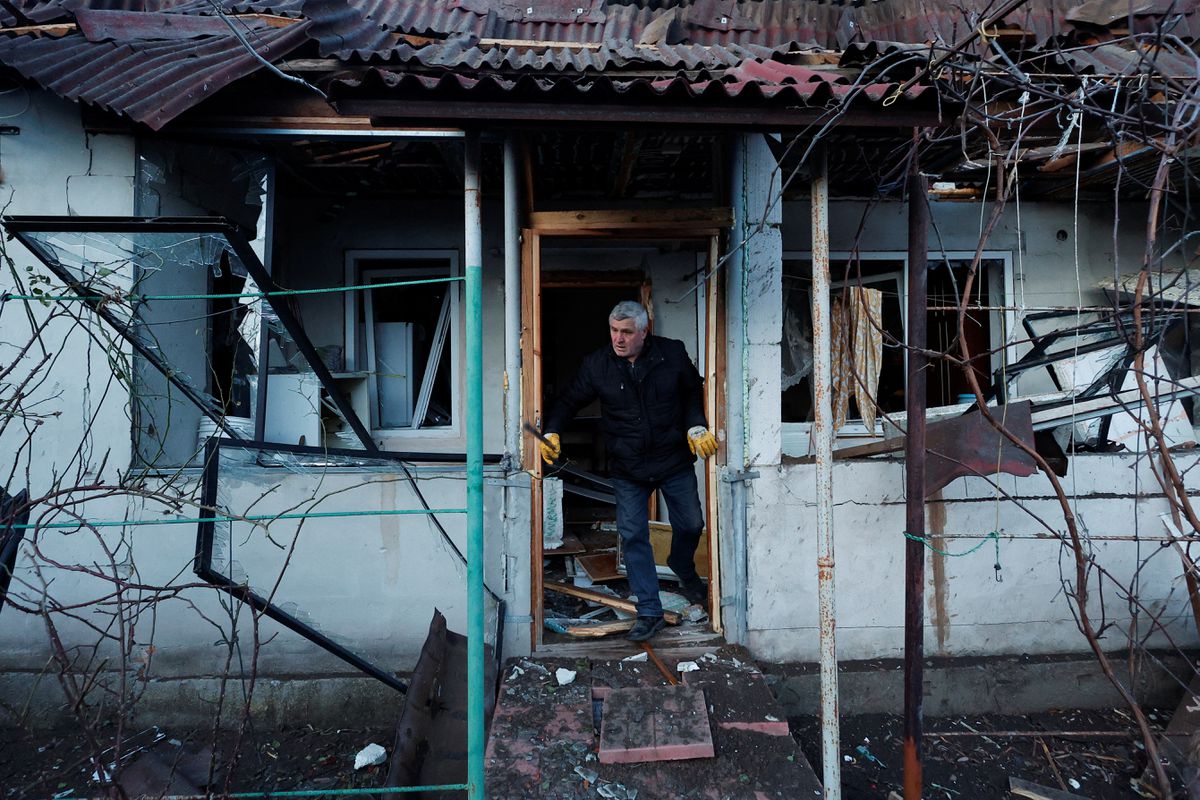 A local resident checks his house after a Russian missile strike, amid Russia's attack on Ukraine, in Kyiv, Ukraine December 31, 2022. 