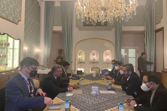 Iranian negotiators (R) meeting with Russia's chief envoy Mikhail Ulyanov in Vienna on March 3, 2022