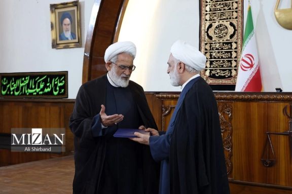 Iran's Chief Justice Gholamreza Mohseni-Ejei (right) former prosecutor general Mohammad-Jafar Montazeri during a ceremony in Tehran on August 6, 2023