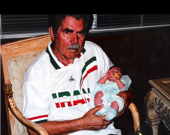 Author's father Ghazanfar Bazargan in 1998, with her 5-day old granddaughter