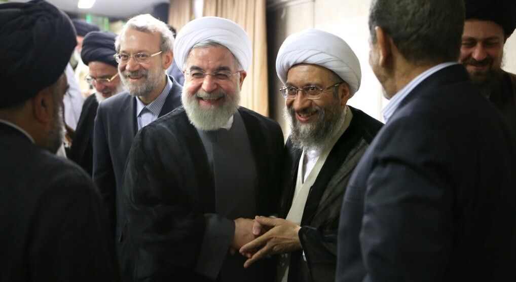 Iran's former president Hassan Rouhani (C) and Ali Larijani (L). Undated. FILE PHOTO