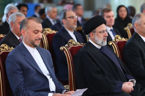Iranian Foreign Minister Hossein Amir-Abdollahian (left) and President Ebrahim Raisi