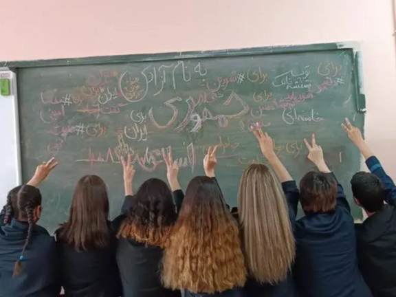 Several schoolgirls unveiling as an act of protest against the Islamic Republic