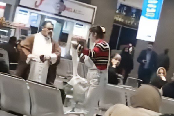 Iranian woman removes cleric's turban in airport confrontation