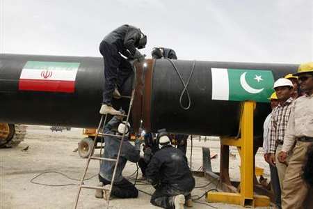 Irani workers weld the pipeline during a groundbreaking ceremony to mark the inauguration of the Iran-Pakistan gas pipeline, in the city of Chabahar in southeastern Iran March 11, 2013.