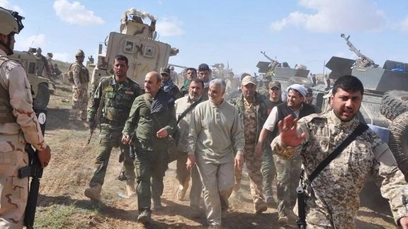 Qasem Soleimani (C) somewhere in Iraq with pro-Iran militia. Undated