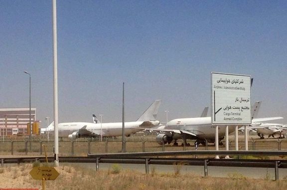 Iranian airliners idle on tarmac in Tehran. Undated