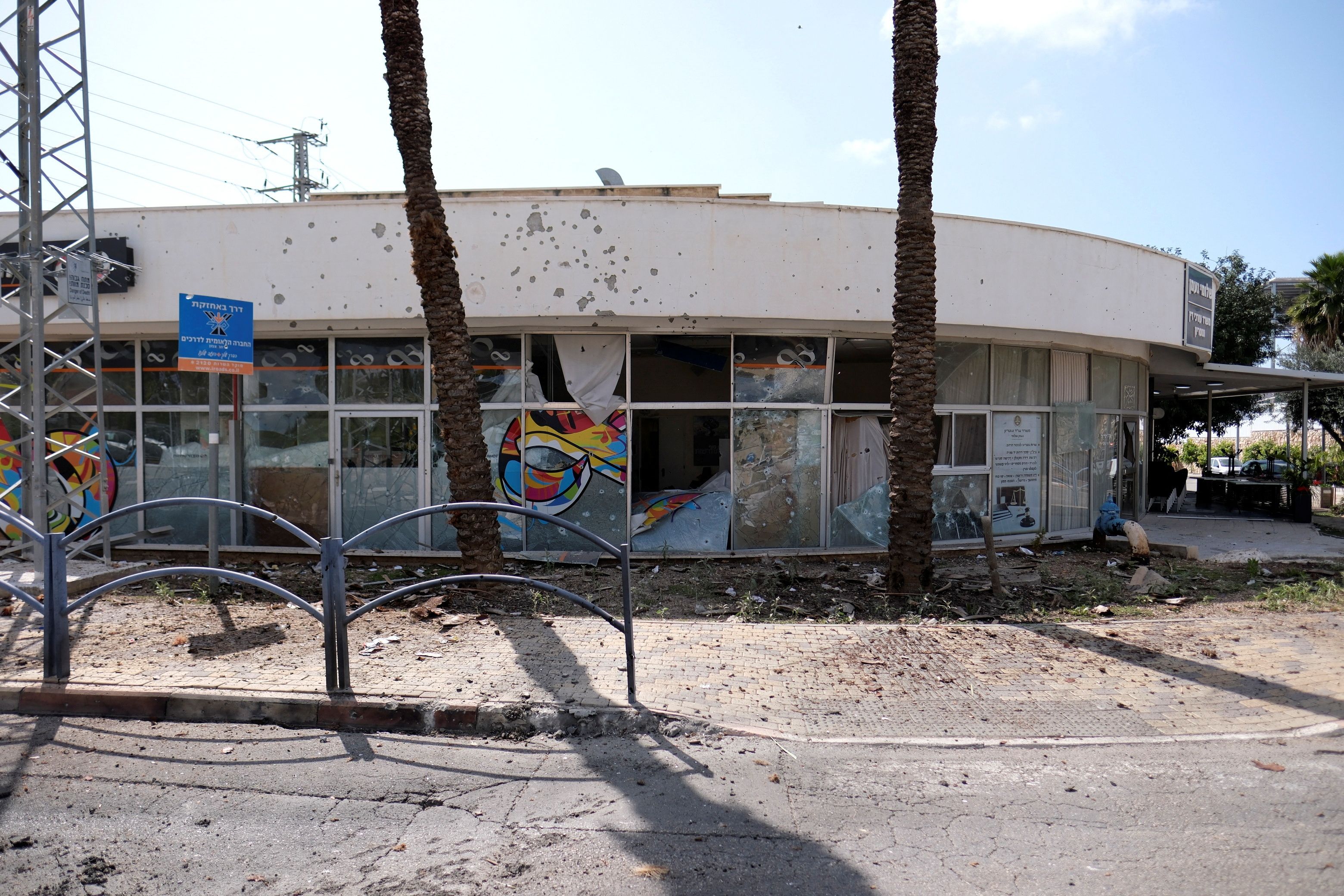 A damaged building of a bank is seen following incoming rockets from Lebanon to Israel in Shlomi, northern Israel April 6, 2023.