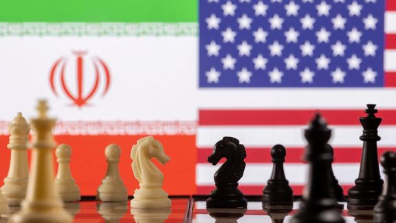 Chess pieces are seen in front of displayed Iran's and US flags in this illustration taken January 26, 2022.