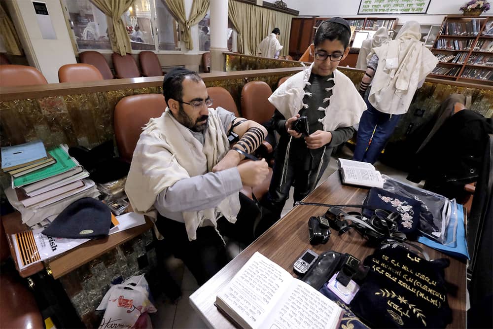 Iranian Jews preparing for prayers at the Abrishami synagogue at Tehran’s Palestine street   (undated)