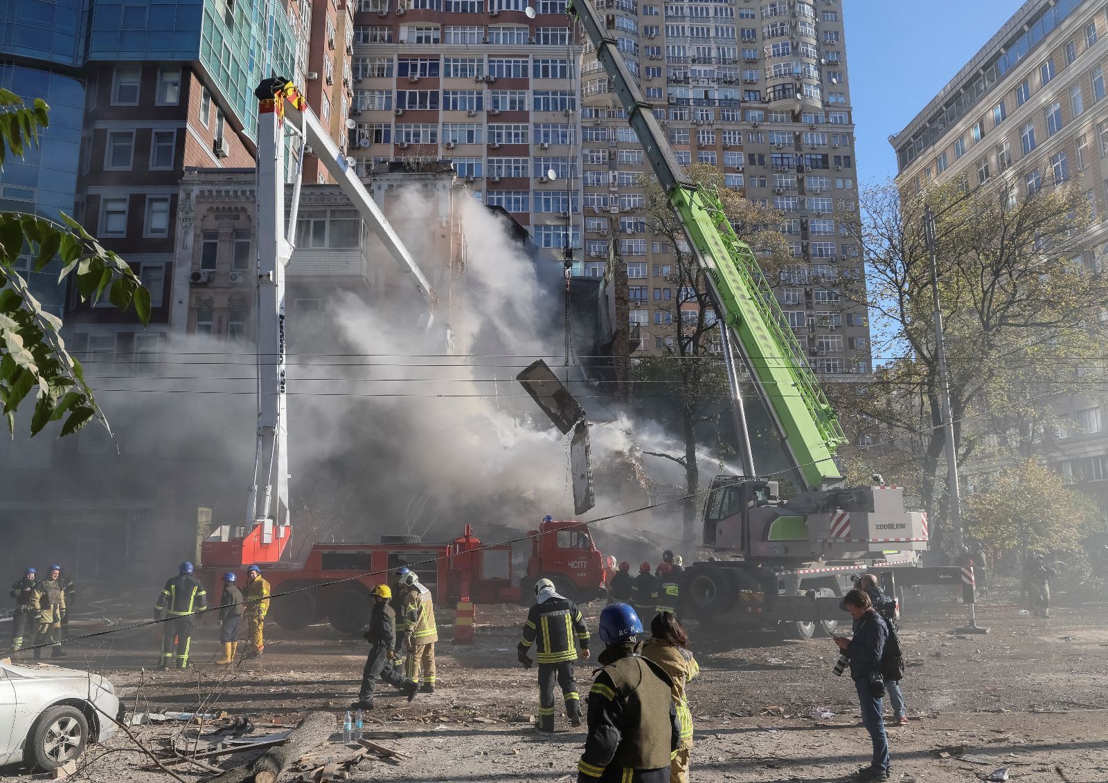 Firefighters evacuating people from a residential building destroyed by a Russian drone strike, which local authorities consider to be Iranian-made unmanned aerial vehicles (UAVs) Shahed-136, Kyiv, October 17, 2022  