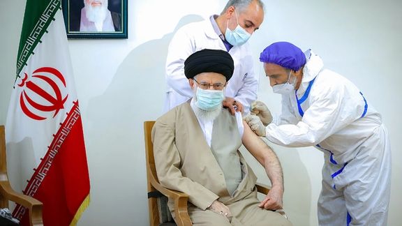 Iran’s ruler Ali Khamenei being vaccinated against COVID-19 in June 2021