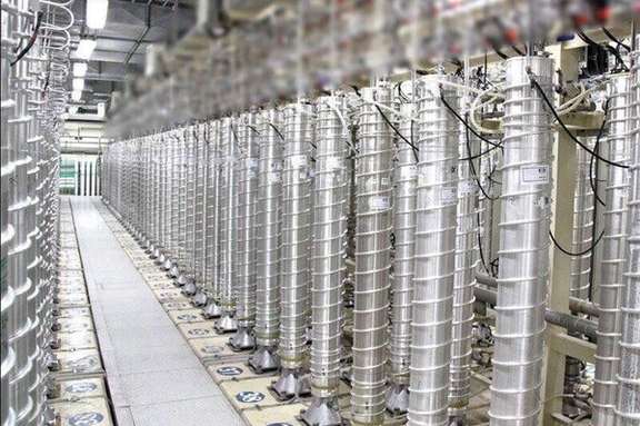Cascades of Iranian centrifuges enriching uranium in an underground facility.