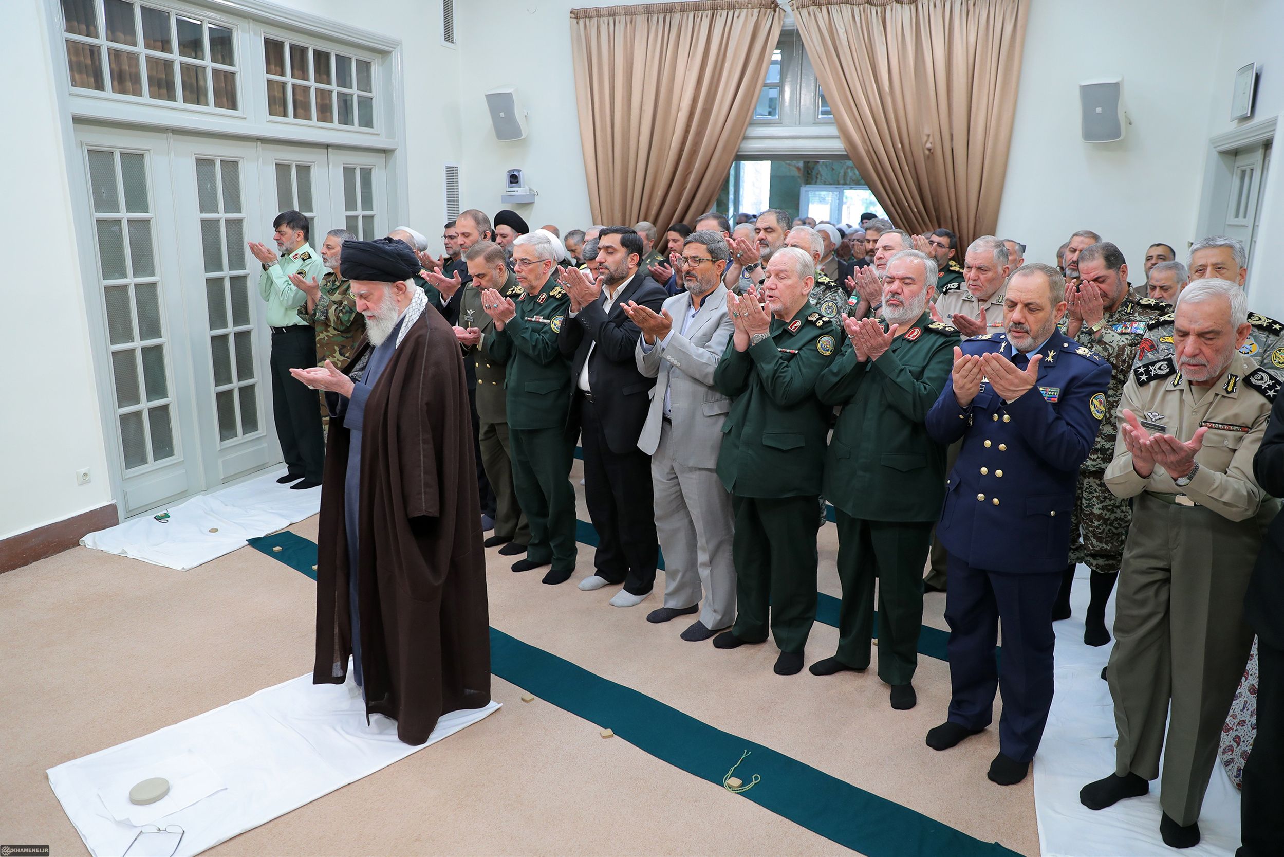 Iran’s ruler Ali Khamenei leading a prayer after a meeting with senior members of Iran’s Armed Forces, Tehran, April 21, 2024 