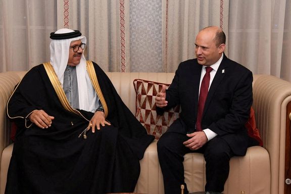 Israeli Prime Minister Naftali Bennett speaks with Bahrain's Foreign Minister Abdullatif Al-Zayani after arriving in Manama, Bahrain, February 14, 2022