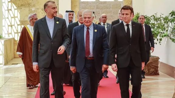 Iranian Foreign Minister Hossein Amir-Abdollahian (left), the High Representative of the European Union for Foreign Affairs and Security Policy Josep Borrell (center), and French President Emmanuel Macron arrive at the start of the "Baghdad Conference for Cooperation and Partnership" in Sweimeh by the Dead Sea shore in central-west Jordan on December 20, 2022.