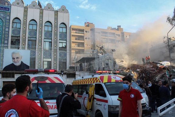 Members of Syrian Red Crescent work near the damaged site after what Syrian and Iranian media described as an Israeli air strike on Iran's consulate in the Syrian capital Damascus April 1, 2024.