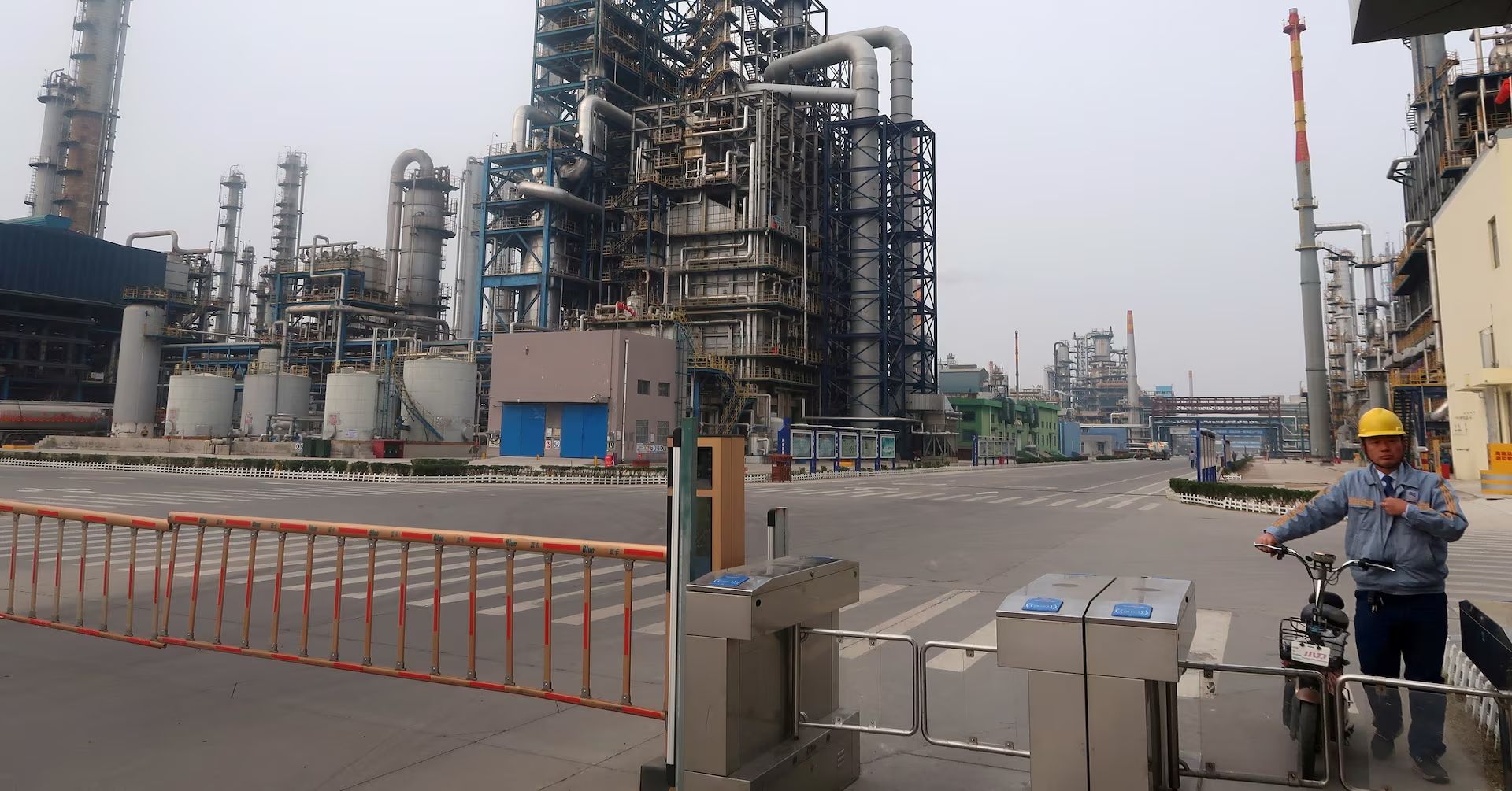 A man is seen at an exit of the refinery plants of Chambroad Petrochemicals in Binzhou, Shandong province, China October 24, 2019.