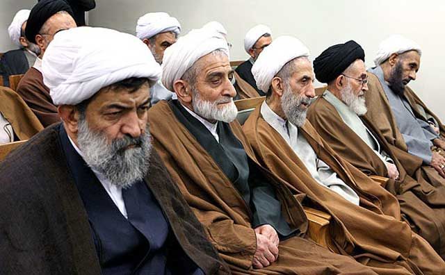 A group of older clerics bored during an official ceremony. FILE