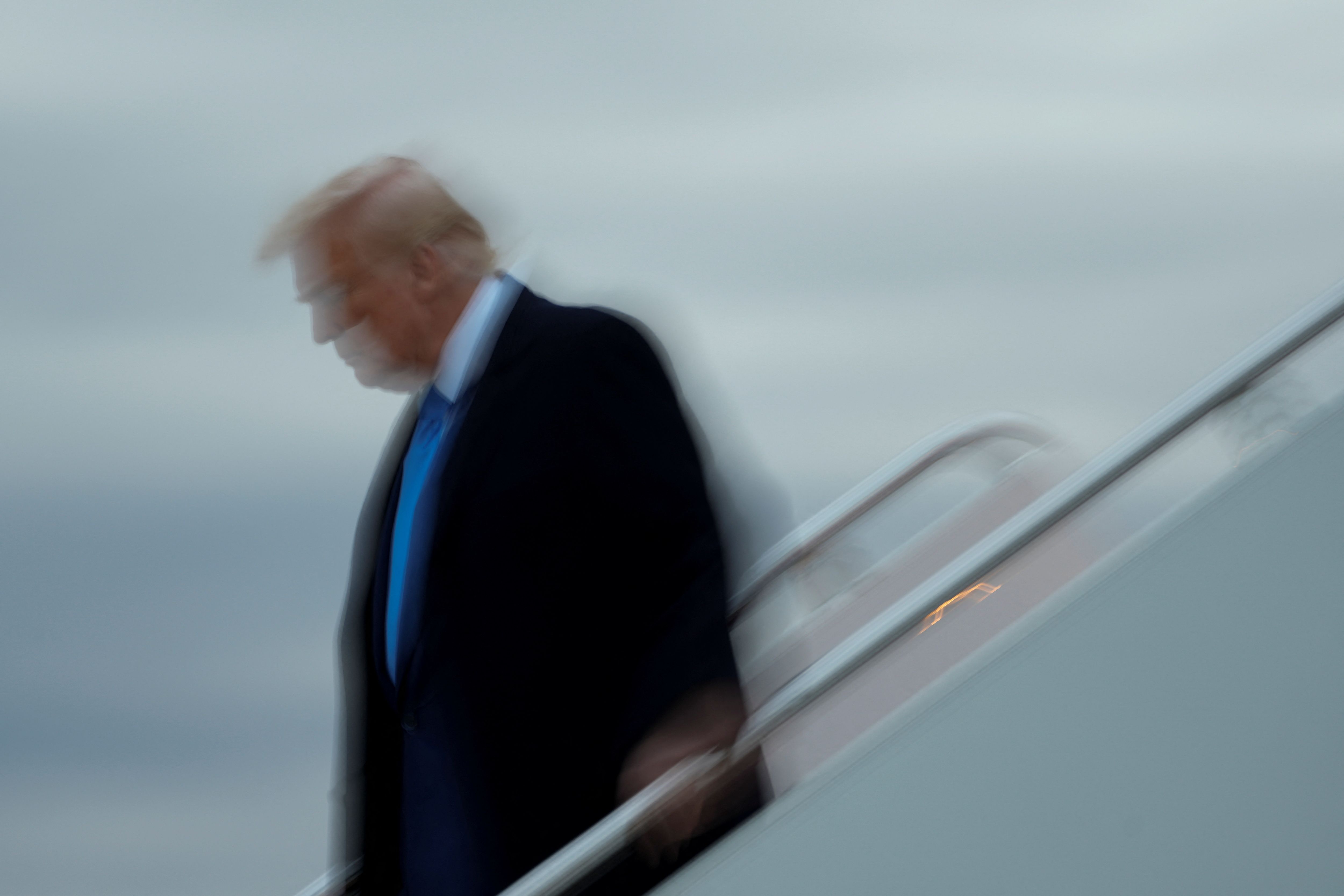 US President Donald Trump disembarks Air Force One as he arrives at Joint Base Andrews in Maryland, April 6, 2025.
