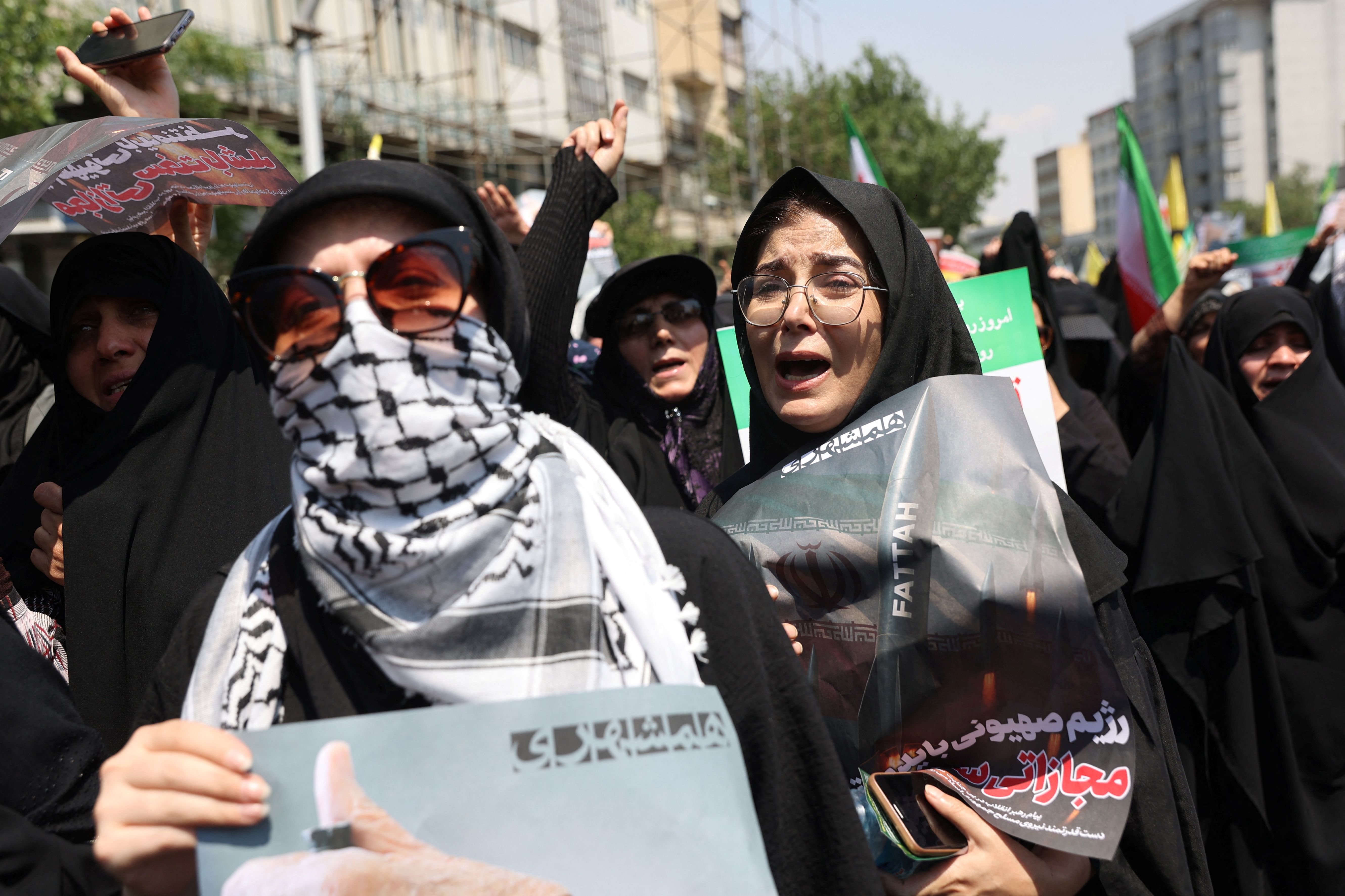 People attend an anti-Israeli protest following the Israeli strikes on Iran, in Tehran, Iran, June 13, 2025. 
