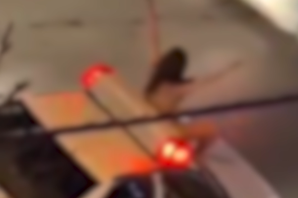 Viral video shows naked woman standing on police car in Iran