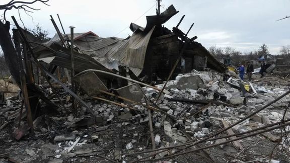 Municipal workers and a police officer inspect remains of a residential building destroyed during a Russian missile and drone strike, amid Russia's attack on Ukraine, in the city of Kamianske, Dnipropetrovsk region, Ukraine March 29, 2024.