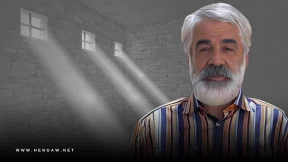 Mashallah Karami, the father of slain protester Mohammad Mehdi Karami, at his grave