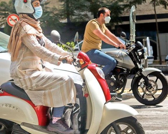 An Iranian woman riding a motorcycle in Tehran